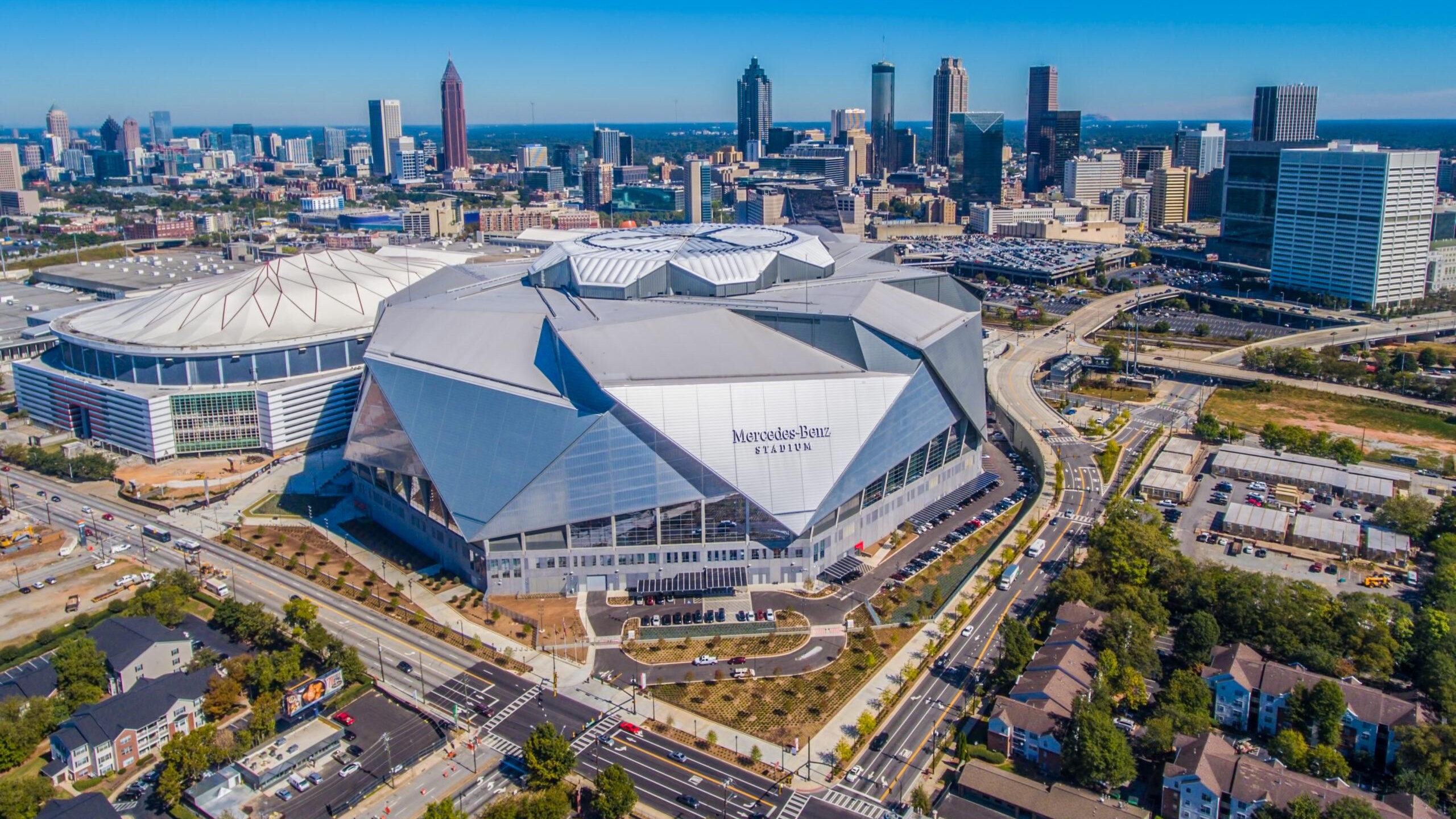 Aerial view of Mercedes-Benz Stadium and the Atlanta skyline