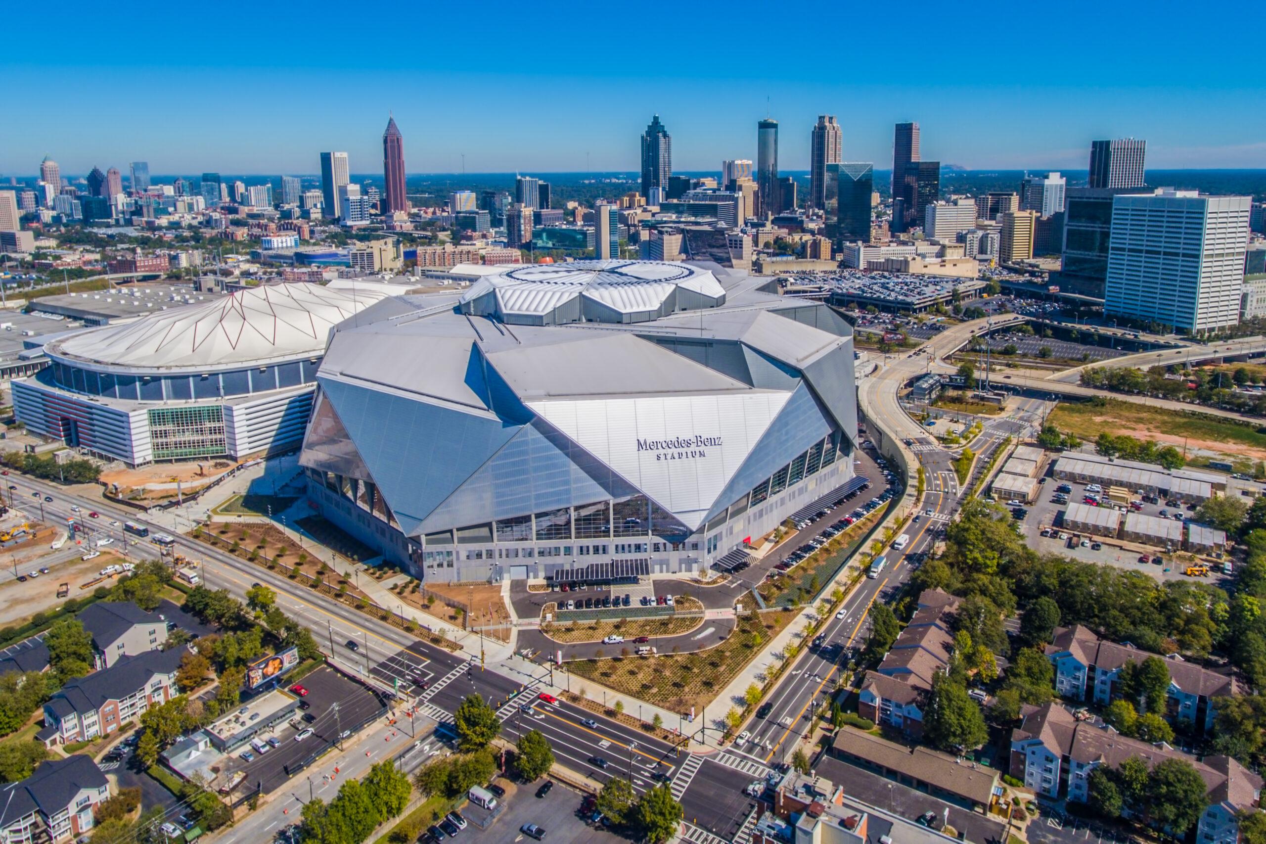Aerial view of Mercedes-Benz Stadium and the Atlanta skyline